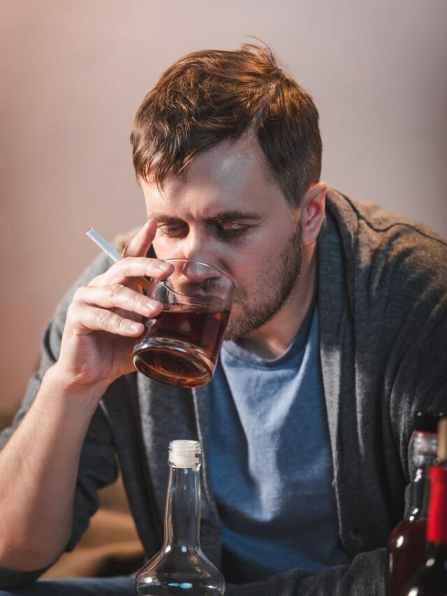 stock-photo-lonely-man-drinking-whiskey-while