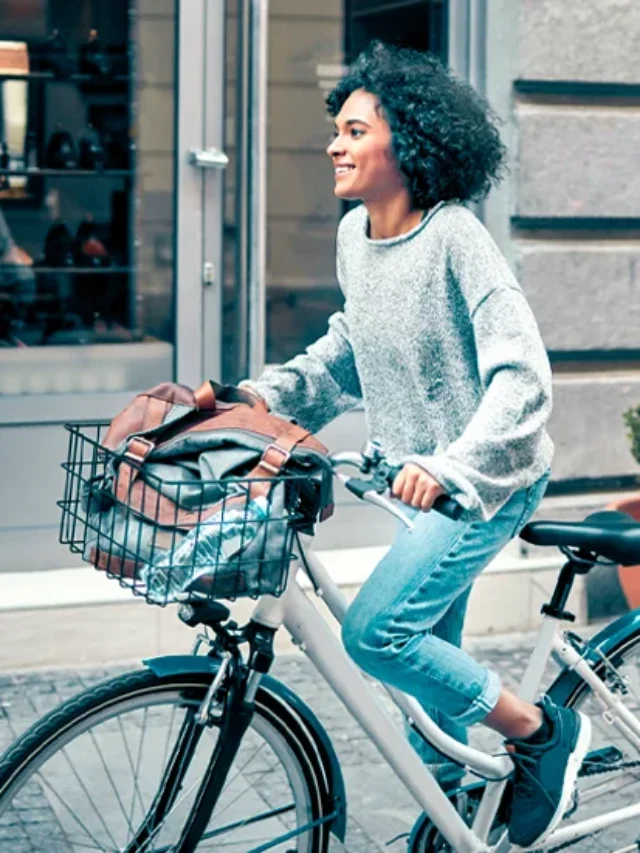 Woman-Riding-Rented-Bicycle-In-A-City.-Cycling-and-smiling-732x549-thumbnail